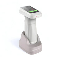 Portable color spectrophotometer with a digital screen and a calibration base, predominantly white with some gray and pink accents.